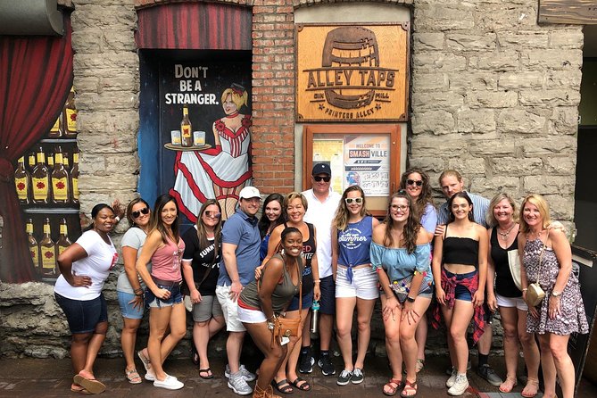 All-Inclusive Pub Crawl with Moonshine, Cocktails, and Craft Beer - Broadway after dark: lively, loud, and unapologetically touristy