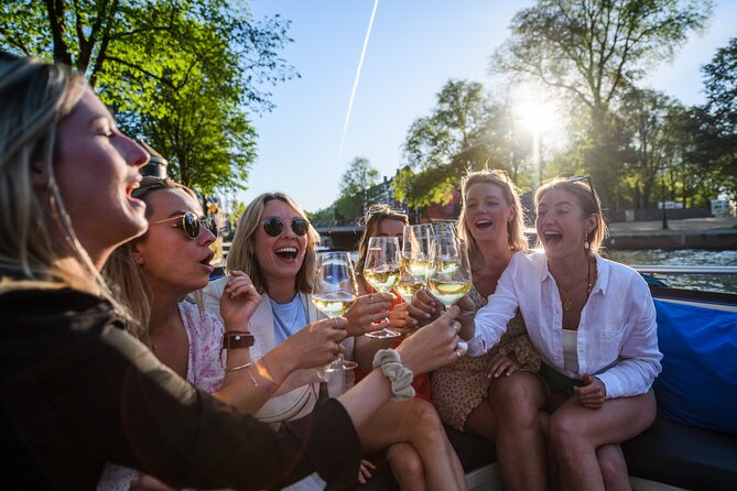 Amsterdam: Canal Booze Cruise with Unlimited Drinks Option - Drinks, food, and the social side