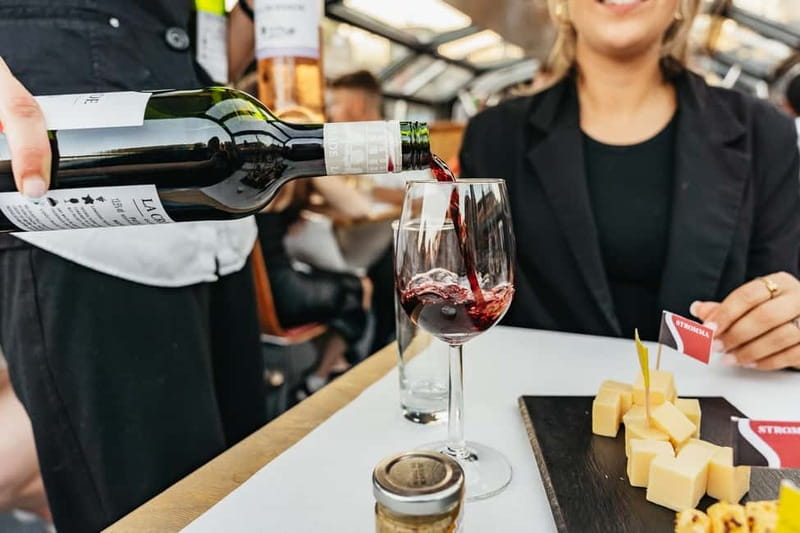 Amsterdam: Cozy Cheese & Wine Cruise Tasting Experience - Damrak to the Canal Belt