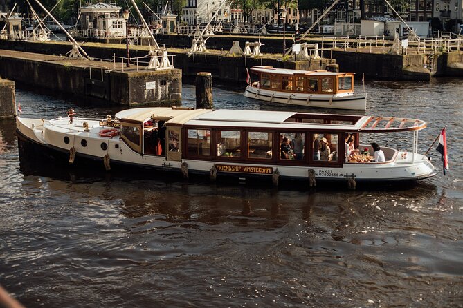 Amsterdam: Luxury Saloon Boat Cruise with Cocktails & Waffle - From the Red Light District to Our Lord in the Attic Museum