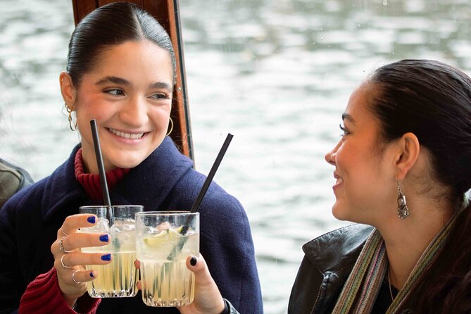 Amsterdam: Luxury Saloon Boat Cruise with Cocktails & Waffle - NEMO, the Maritime Museum, and Montelbaanstoren