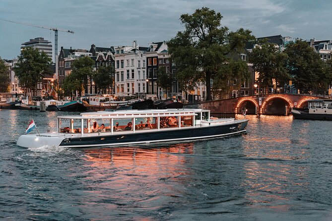 Amsterdam Small-Group Evening Canal Cruise Including Wine, Craft Beer, Cheese - Wine, beer, and a cheese board for the group