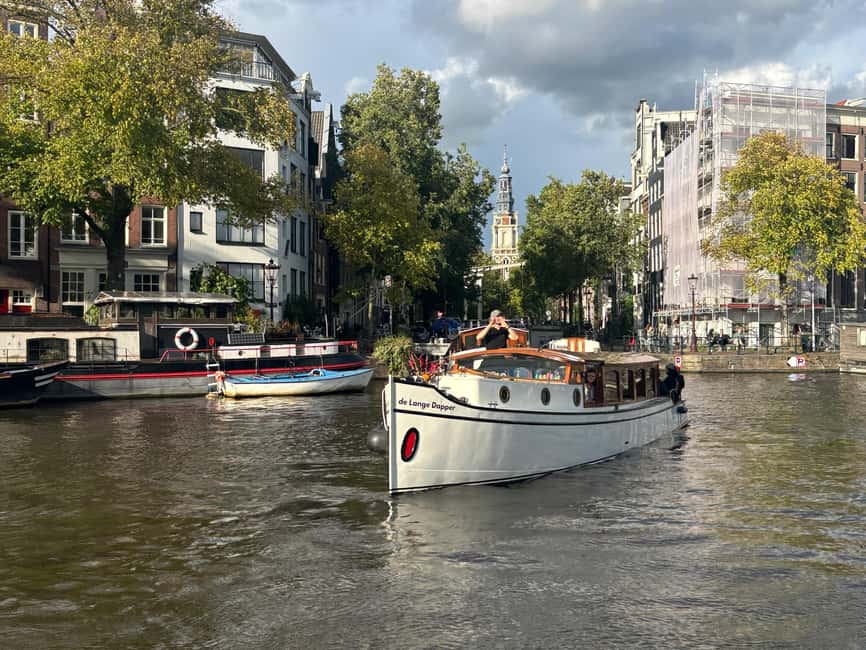 Amsterdam: The Bulldog Boat Smoke and Booze Cruise - Following the old city wall toward the Amstel
