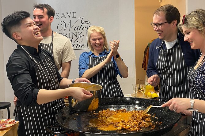 Barcelona Paella Cooking Class & Boqueria & Hofmann-Trained Chefs - Learning the socarrat over open flames