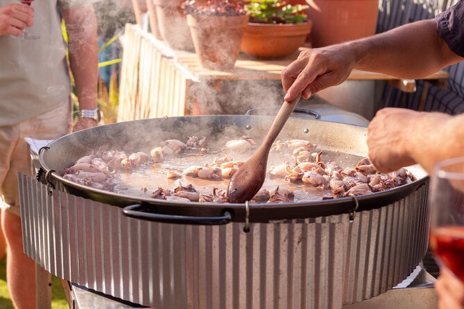 Barcelona Rooftop Paella Cooking Class with Sangria & Local Host - Making the sofrito, broth, and rice