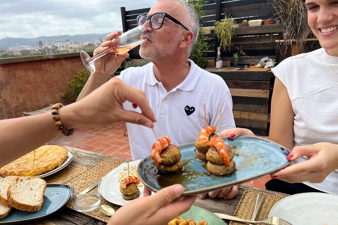 Barcelona: Rooftop Tapas & Sangria class with a Local Chef - Cooking tapas inside a Barceloneta home