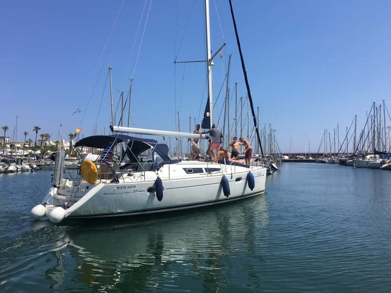Barcelona: Sunset Boat Trip with Cava Wine and Snacks - Music, seating, and the feel on board