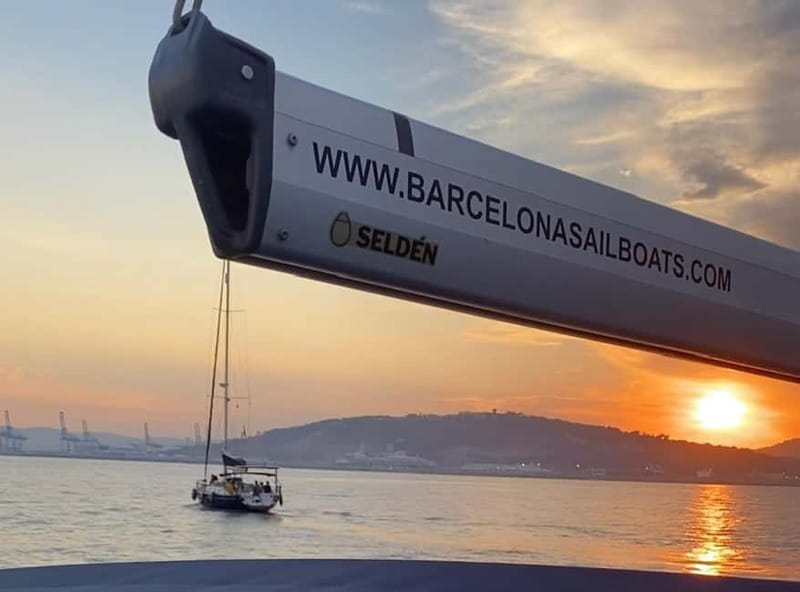 Barcelona: Sunset Boat Trip with Cava Wine and Snacks - A chance to steer the sailboat