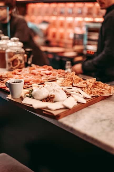 Barcelona: Tipsy Tapas & History Tour in the Gothic Quarter - First stop: traditional flavors in a tucked-away bar