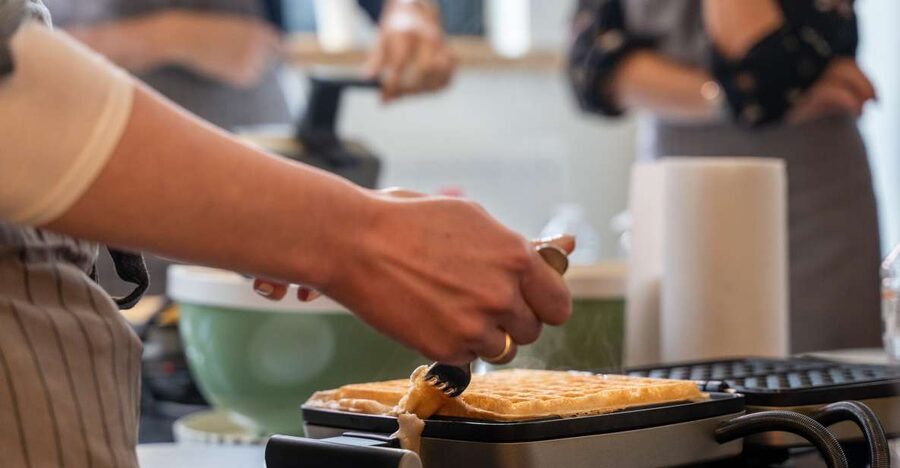 Bruges: Belgian Waffle-Making Workshop with Beer Tasting - Cooking several waffles in the irons
