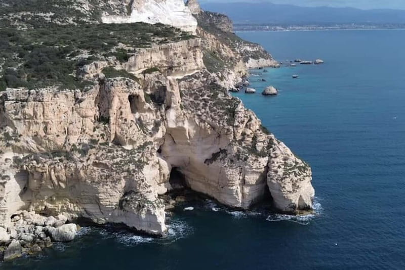 Cagliari: Catamaran Tour, Swimming, Snorkeling, & Prosecco - The Devil’s Saddle from the water