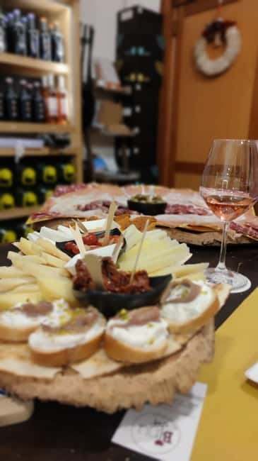 Cagliari: Food and Wine Tasting Experience - What makes the family-shop setting valuable
