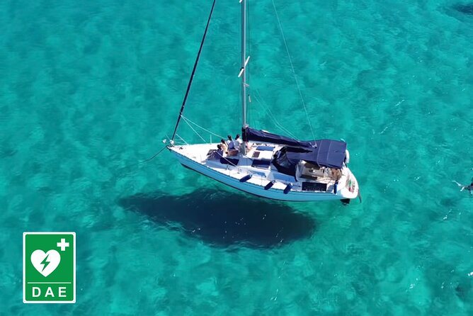 Catamaran tour stops bathing and snorkeling toast with prosecco - Leaving the port with Cagliari behind you