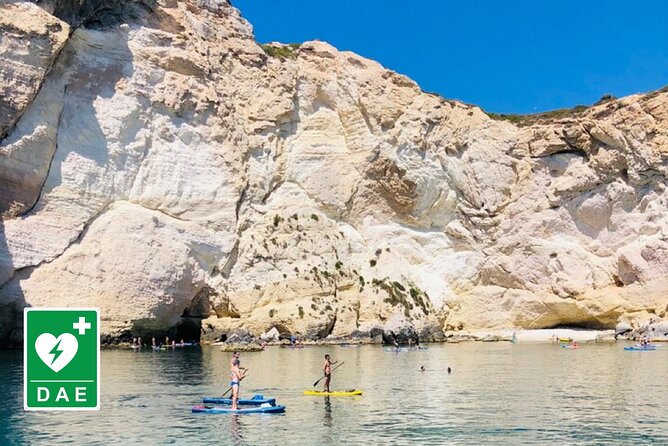 Catamaran tour stops bathing and snorkeling toast with prosecco - Cala Mosca, white cliffs, and old coastal traces