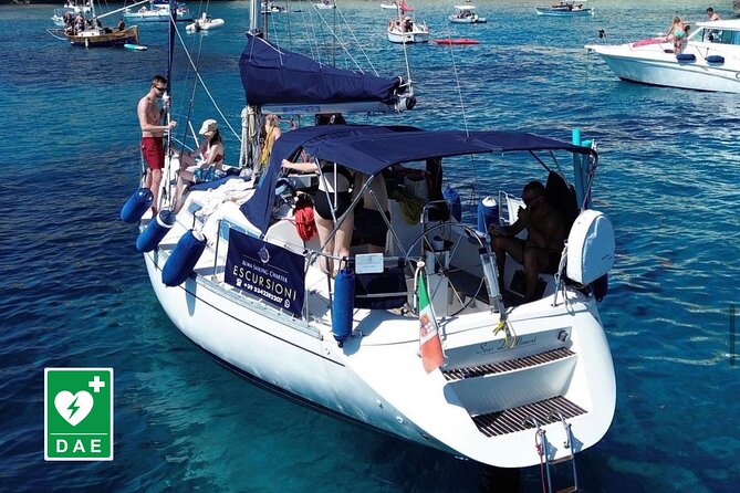 Catamaran tour stops bathing and snorkeling toast with prosecco - One hour at Sella del Diavolo
