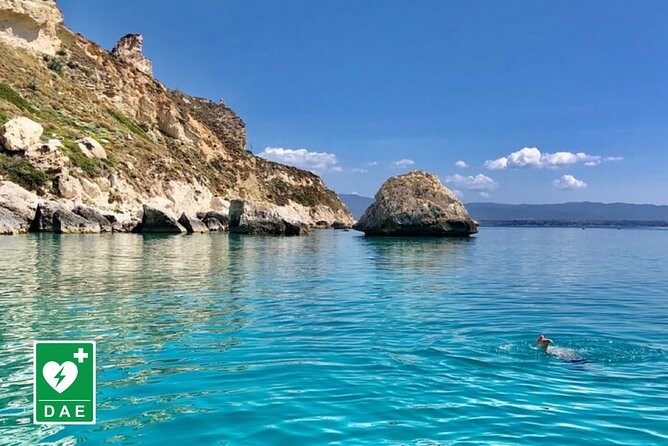 Catamaran tour stops bathing and snorkeling toast with prosecco - Cala Mosca and the first coastal sights