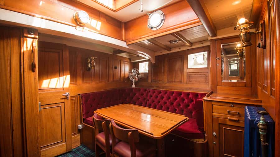 Evening Champagne Cruise on Historic 1935 Motor Yacht. - Boarding Faith at Te Anau’s historic wharf