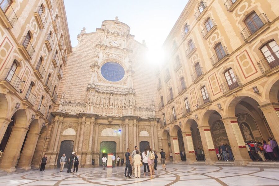 From Barcelona: Montserrat Half-Day Wine and Tapas Trip - The basilica and the story of Montserrat