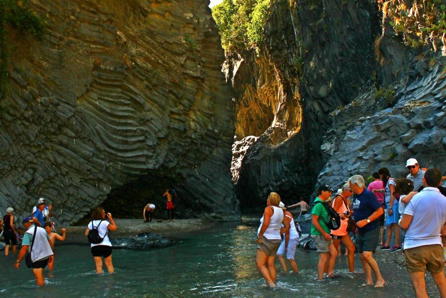 From Catania: Mt. Etna, Wine and Alcantara Tour - Entering a lava cave with a helmet and lamp