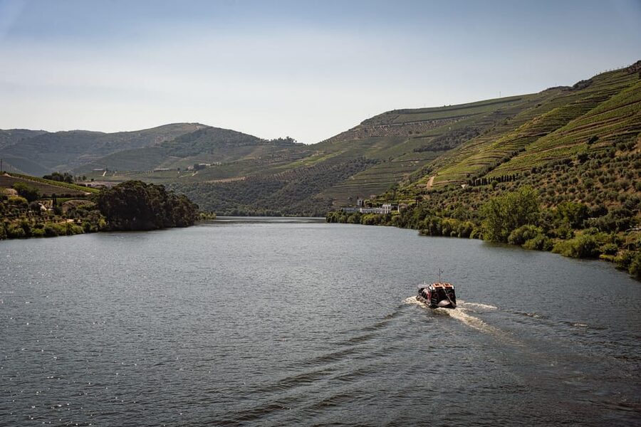 From Pinhão: Douro Valley Rabelo Boat Tour with Port Wine - A river view of the Douro wine country