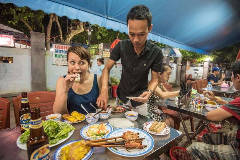 Hoi An: Sunset Food Tasting Tour - BBQ pork, rice paper, and fresh herbs at a local cafe
