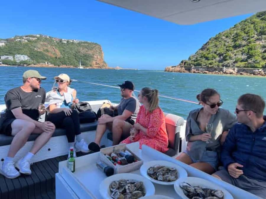Knysna Lagoon: Boat Cruise with Oyster & White Wine Tasting - Learning the oyster story on the lagoon