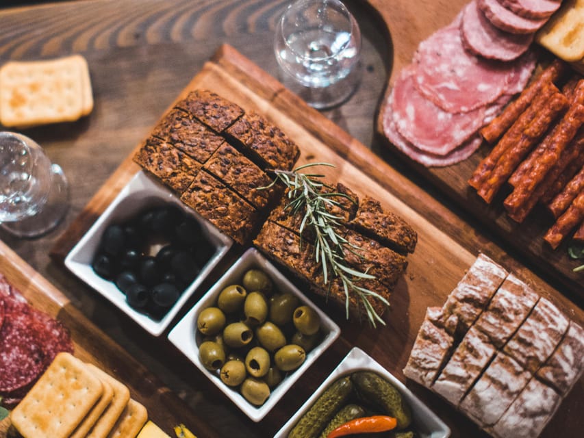 Krakow: Vodka Tasting Tour: Tapas, Tipsy Tales & Hidden Gems - The first stop: tapas before the shots