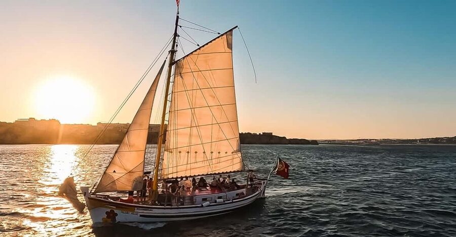 Lagos: Sunset Sail aboard a Traditional Boat with Prosecco - Along the golden cliffs and sea caves
