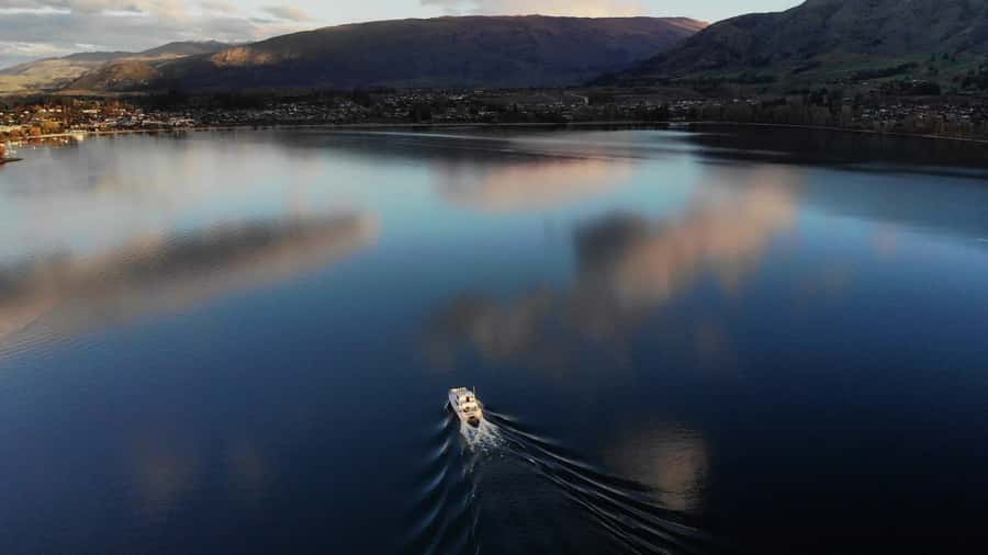 Lake Wanaka Happy Hour Cruise - A glass of New Zealand wine and a simple snack