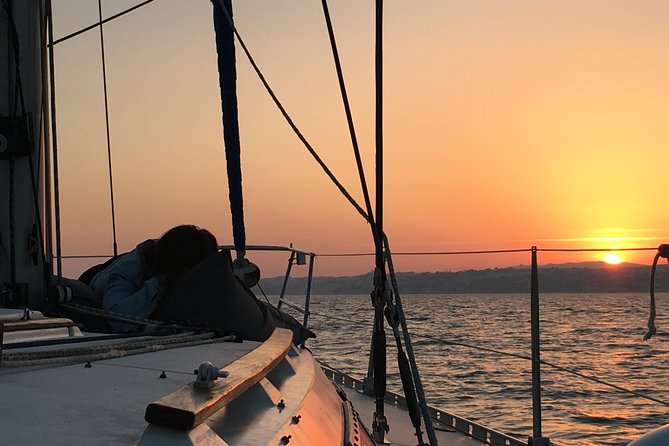 Lisbon Sunset Sailing Tour with White or Rosé Wine and Snacks - Wine, cheese, chouriço, and the social side of the trip