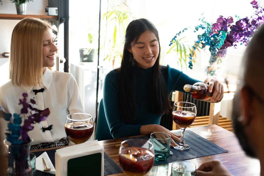 Madrid: Paella & Sangria Classes – Seafood, Chicken or Vegan - Sitting down to eat in a Spanish-themed room