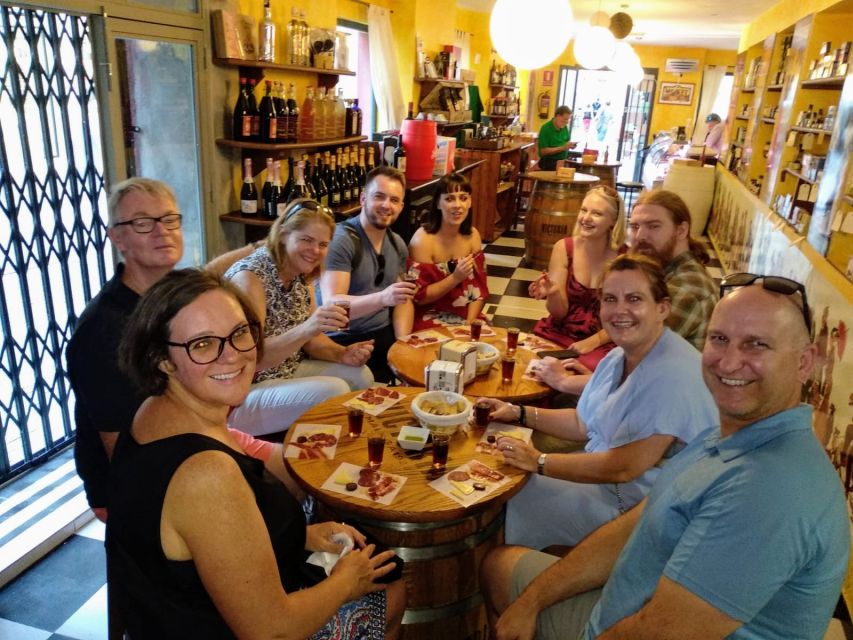 Málaga: Wine & Tapas Tour - Passing Iglesia de San Juan and moving into the bar circuit