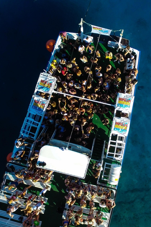 Malia: Booze Cruise Boat Party with Live Dj - DJs, MCs, and the sunset return