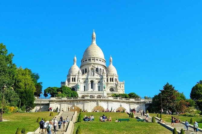 Montmartre Hill French Gourmet Food and Wine Tasting Walking Tour - Starting near the Moulin Rouge