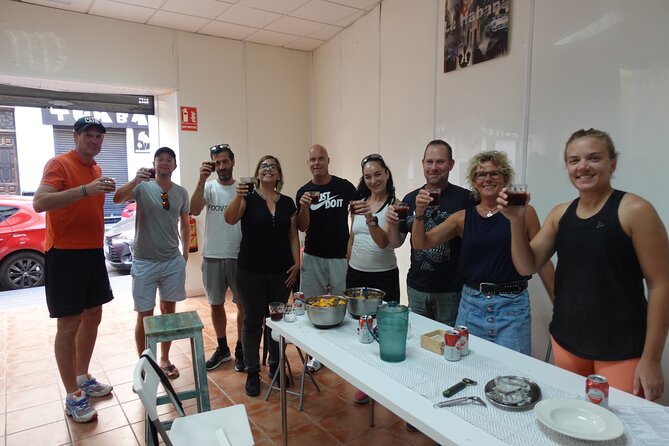 Paella & Sangria Class with Tapas and Market Visit - Eating the paella you helped cook
