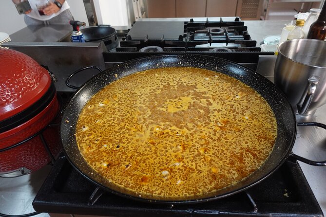 Paella & Sangria Class with Tapas and Market Visit - Making sangria while the rice cooks