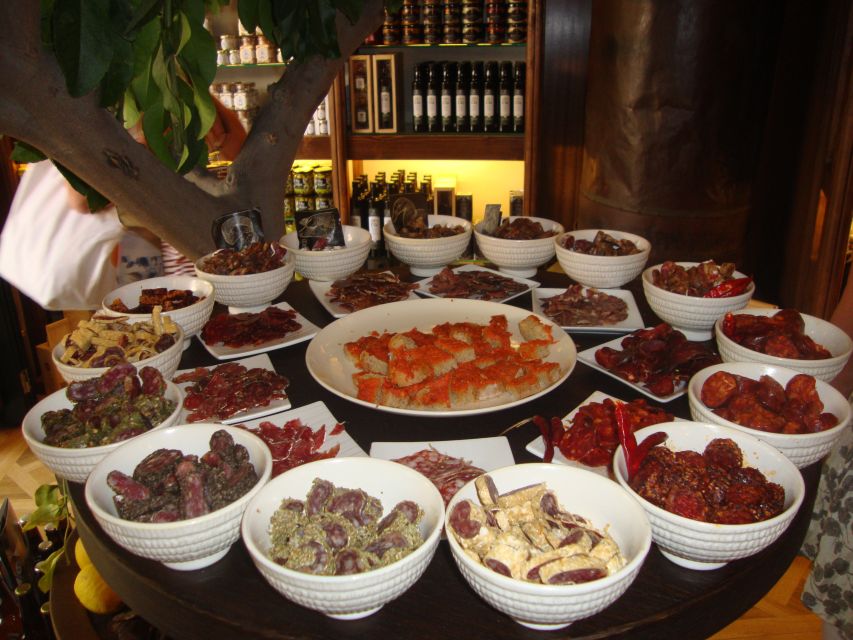 Palma Tour with Wine and Tapas Tasting - Olive oil, ham, cheese, and Spanish products