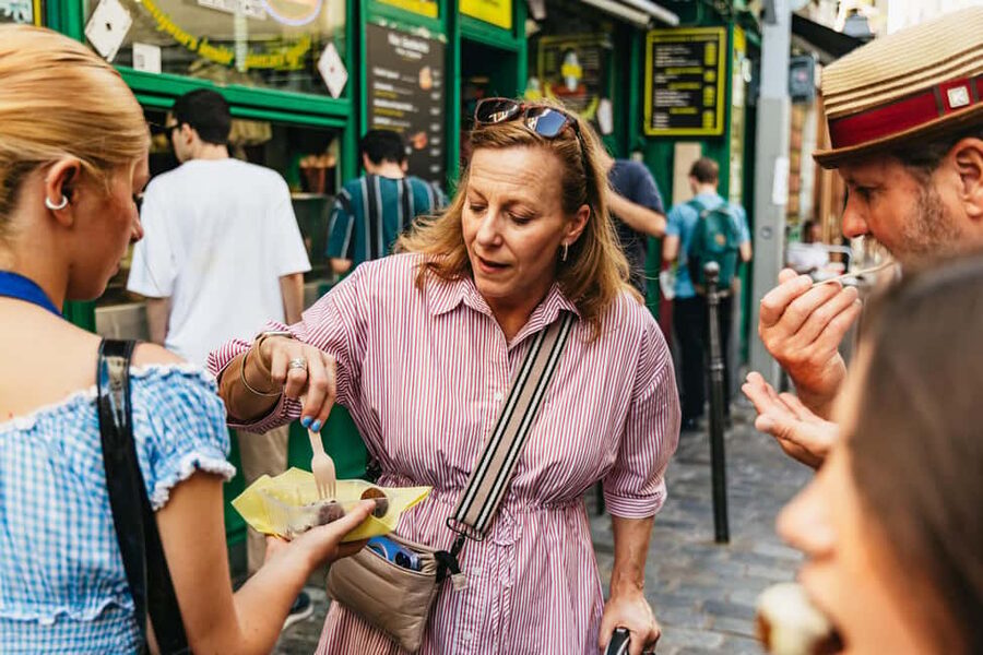 Paris: Walking Food Tour with Cheese, Wine and Delicacies - Charcuterie, ham, and the restaurant stop