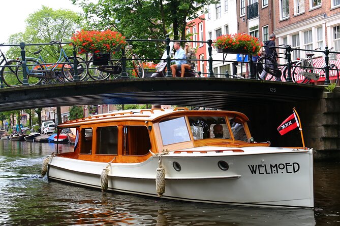 Private Champagne Canal Cruise in Amsterdam - Rain, cold weather, and evening comfort