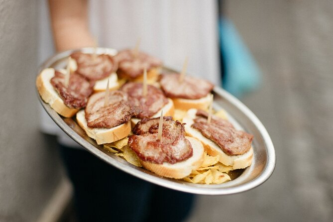 Private Seville Tapas & History Tour - Las Golondrinas: Iberian pork and local summer wine