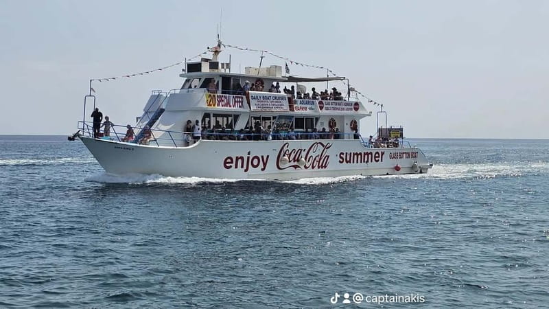 Protaras Blue Lagoon Sunset Tour with Pizza & Champagne - Champagne, pizza, and fruit on the return