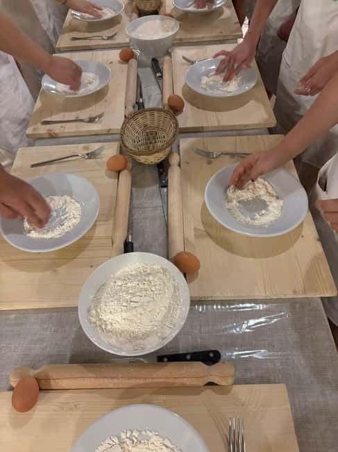 Rome: Rooftop Cooking Class with Wine Tasting near Vatican - Choosing a sauce and sitting down to eat