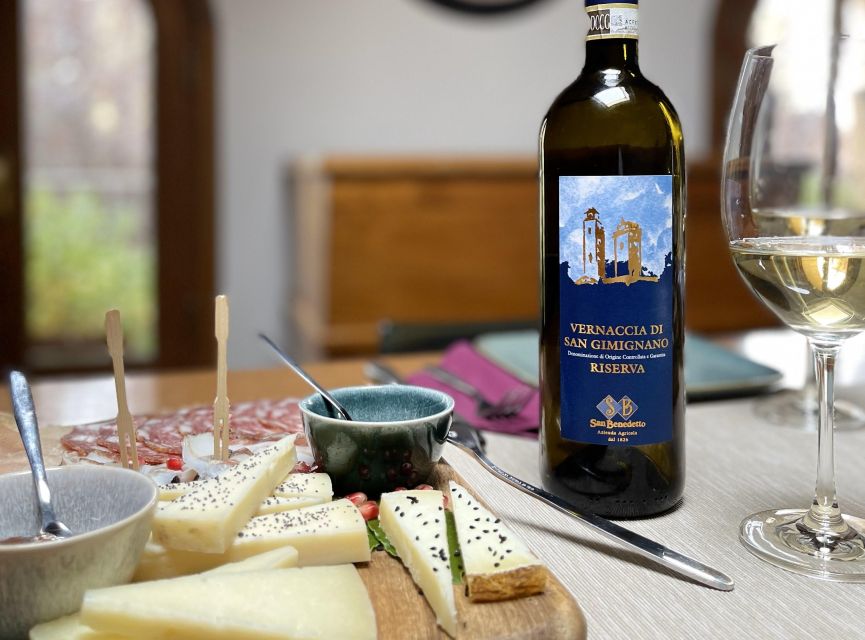 San Gimignano: Vineyard and Cellar Tour with Wine Tasting - Walking through the vineyard near the winery