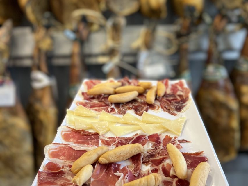 San Sebastian: Market, Pintxos and Wine Tasting Tour - Four Old Town stops, each with a different purpose