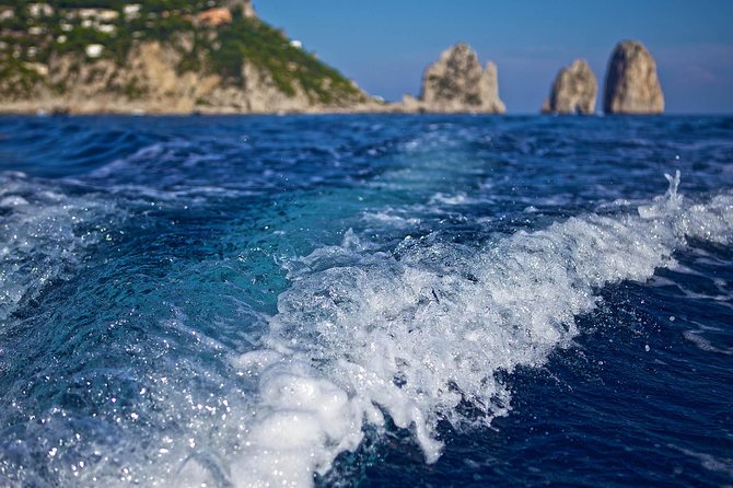 Small Group Capri Island Boat Ride with Swimming and Limoncello - The Faraglioni swim and onboard happy hour