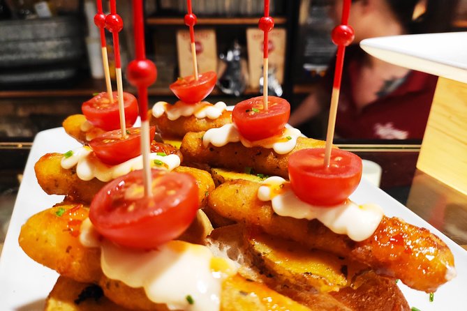 Spanish Wine and Tapas Tour in a Local Neighborhood in Barcelona - Four bars, four wines, and a different side of Barcelona