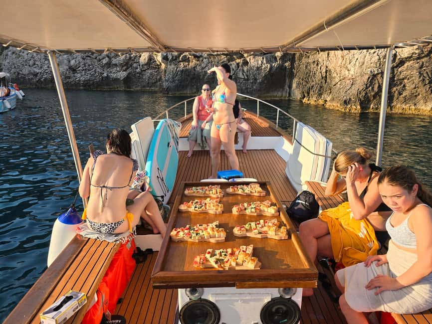Taormina: Boat Tour with Sicilian Wine Tasting - Sicilian wine, cheese, and local food