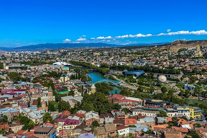 Tbilisi Walking Tour Including Cable Car and Traditional Bakery - Clock towers, cathedrals, and Georgian stories